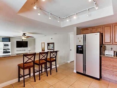 Remodeled kitchen opens to Family Room (Mounted TV