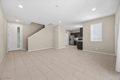 Unfurnished living room featuring recessed lighting and light tile patterned floors