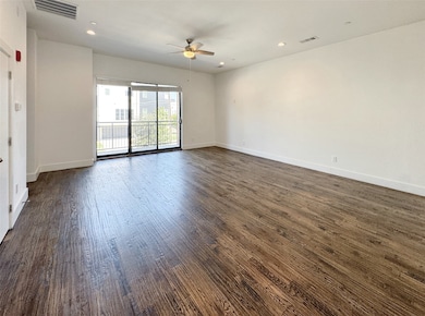 Spare room featuring recessed lighting, dark wood finished floors, and ceiling fan