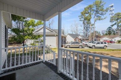 Balcony featuring a residential view and covered p