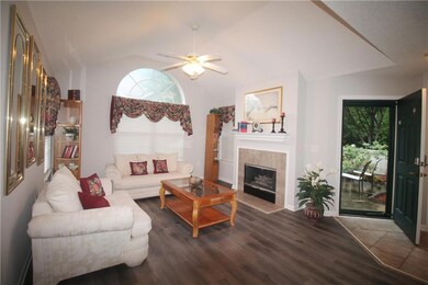 Living area with luxury vinyl floors, fireplace wi