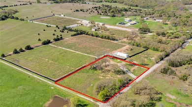 Birds eye view of property featuring a rural view