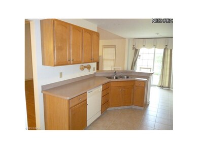 View of kitchen from garage entrance, which also h