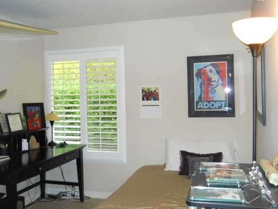 Bedroom two- dual paned windows with plantation sh