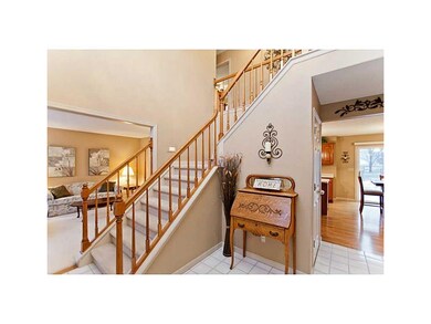 Foyer. Tiled entry with 2 story open staircase.