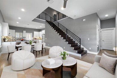 Living room featuring baseboards, stairs, recesse