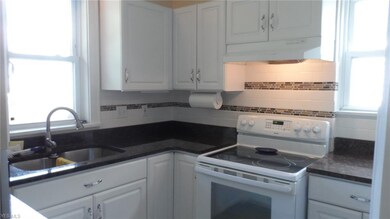 Kitchen with new back splash and granite counter t