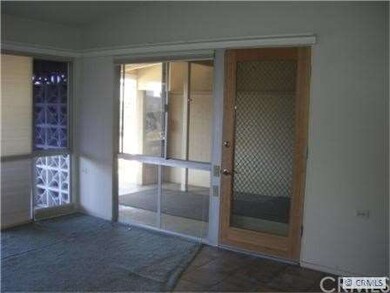 Designer wood/glass front door entrance off of sid