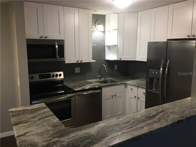 3259 Fox Chase Cir N unit 101, Palm Harbor, FL 34683 - photo 2