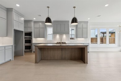 The oversized kitchen island creates the perfect g