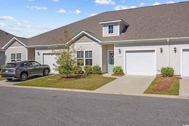 View of front of property with board and batten si