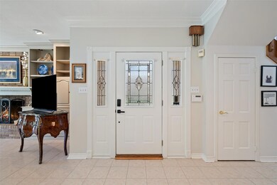 Entryway with light tile patterned floors, a bric