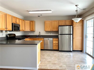 Eat-in Kitchen with SS Appliances & Corian Cou