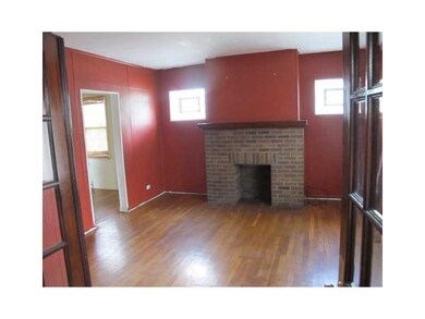 Living Room. Gleaming hardwood flooring, deco fire