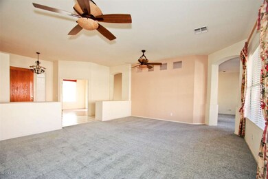 Living room looking at front door & den