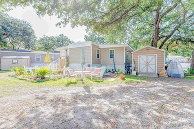 View of front of property with a shed