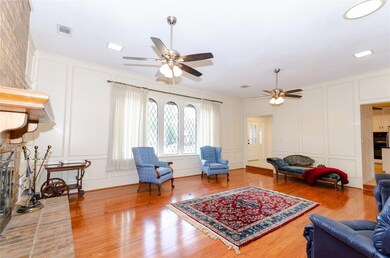 Living area featuring visible vents, wood finished