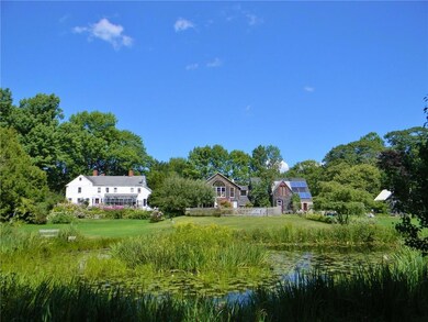 View of the house and two barns from...