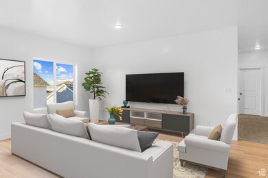 Living area featuring light wood-type flooring and recessed lighting