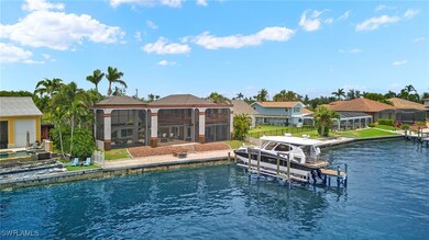 View of exterior lanai featuring a boat dock, a wa
