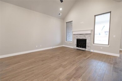 Unfurnished living room with a stone fireplace, hi