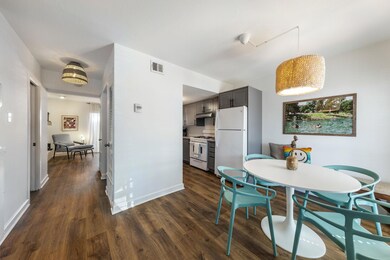 Dining area featuring baseboards, dark wood-style