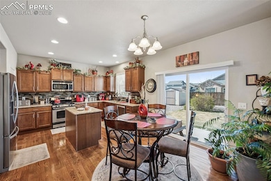 Dining area off the kitchen with hardwood floors a