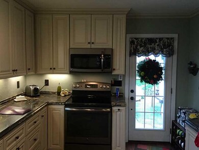 Kitchen. Kitchen leads to quiet back fenced back y