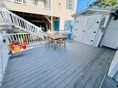 Deck featuring a storage unit