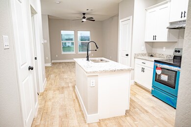 Kitchen w/ dining in background
