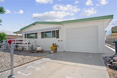 Manufactured / mobile home featuring driveway and