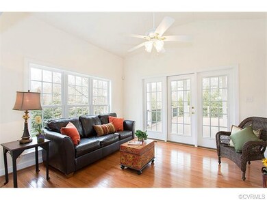 Delightful sunroom with cathedral ceiling provides