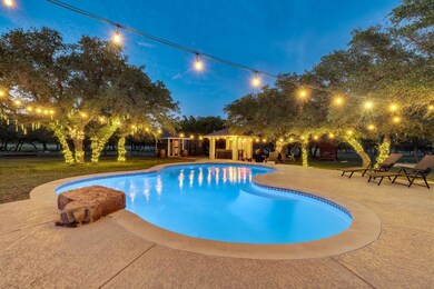 Outdoor pool featuring a patio area and a yard