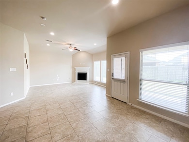 Large family room with fireplace and high ceilings