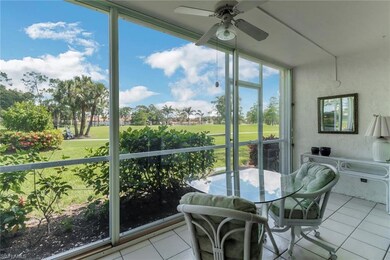 Sunroom / solarium featuring ceiling fan and view of golf course