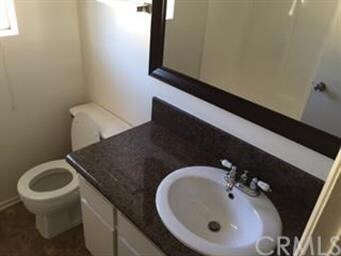 Bathroom has granite counter, new sink and reglaze