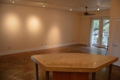 Unfurnished dining area with french doors, rail l