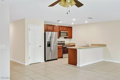 Kitchen with stainless steel appliances, a peninsu