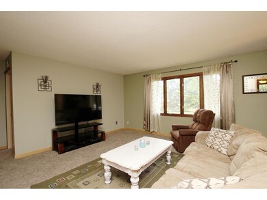 Spacious upper level living room! Brand new carpet
