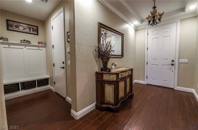 Formal entry with 'wood' plank tile floors thruout