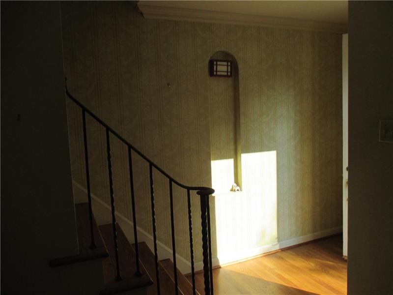 Stairway to the 2nd floor, quest closet and front 