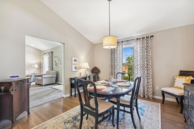 Separate dining room with hardwood floors.