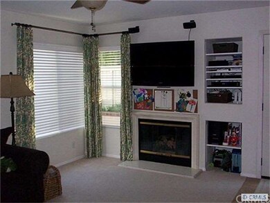 Family room with cozy fireplace.