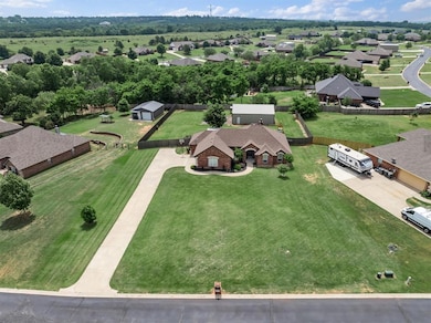 Aerial view of home plus shop and almost 1 acre
