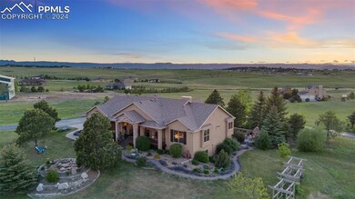 Aerial view at dusk featuring a rural view