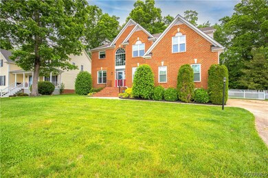 Exterior front of the home view to the paved driveway up to the entrance to the side-entry, 26X20 two-car attached garage