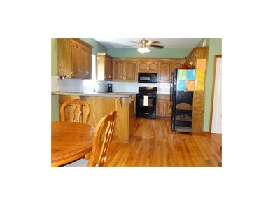 Lots of cabinets in this eat in kitchen