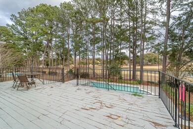 Deck overlooking pool and golf course