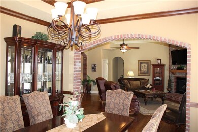 Formal Dining Room with archway to Living Room.