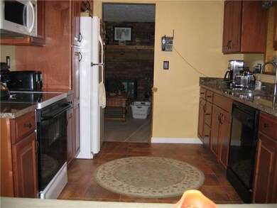 Kitchen. The updated kitchen also accesses the fam